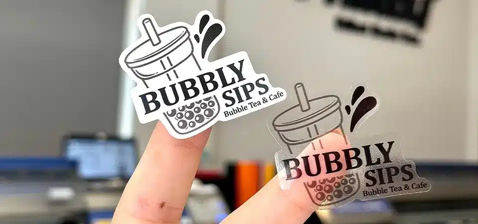 A split image showing a design on a white vinyl roll and a clear vinyl roll.
