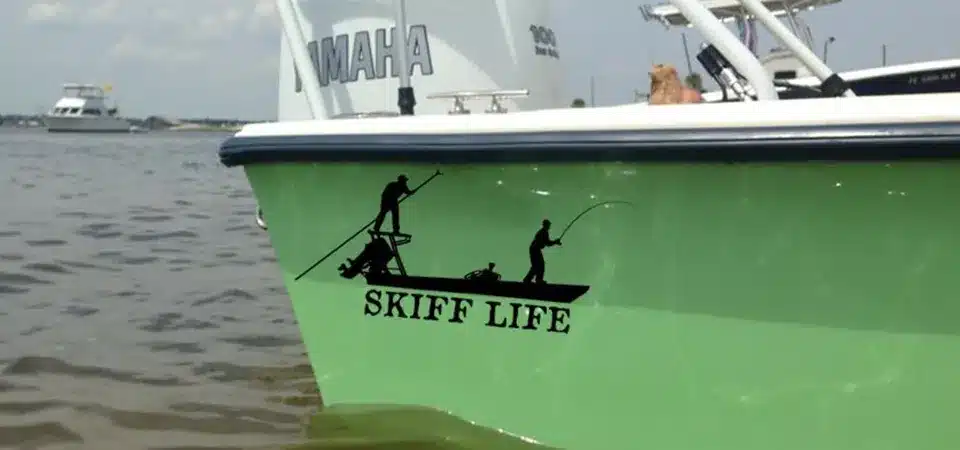 A side-by-side comparison of a complex, hard-to-read boat name sticker versus a bold, clear, and simple one.