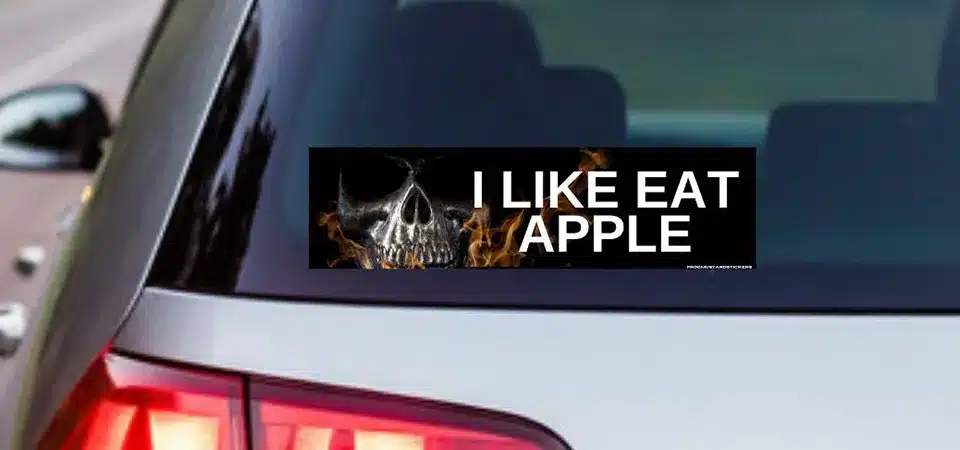 A person using a tablet to design a custom bumper sticker with simple graphic design software.