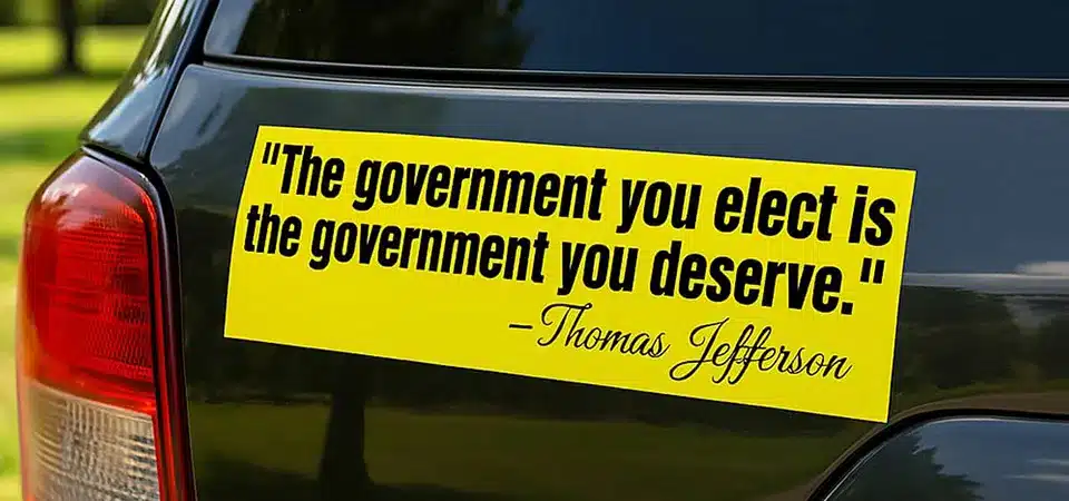 A modern car bumper with highly specific, niche meme stickers and a QR code sticker.