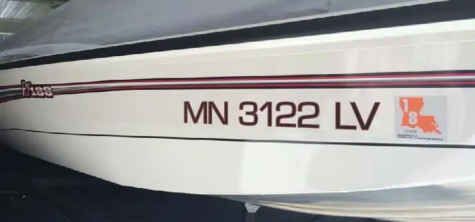 A close-up shot showing the durability of a marine-grade vinyl sticker enduring water splashes and sun.