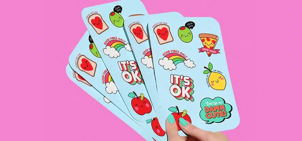 An image comparing an individually die-cut sticker next to a roll of product labels.