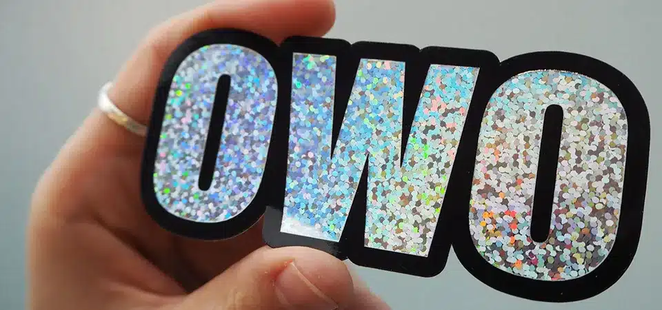 A fun glitter sticker on a birthday card and another on a makeup product.