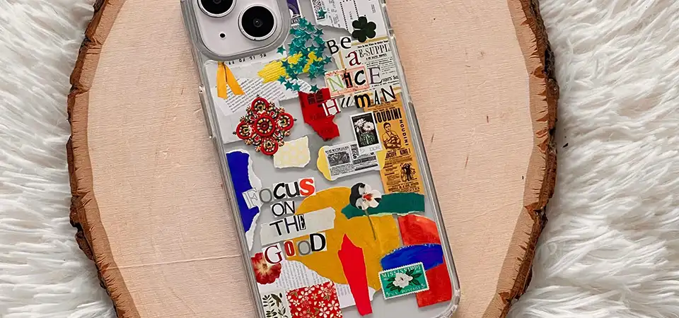 A clear phone case with a paper insert decorated with stickers behind it