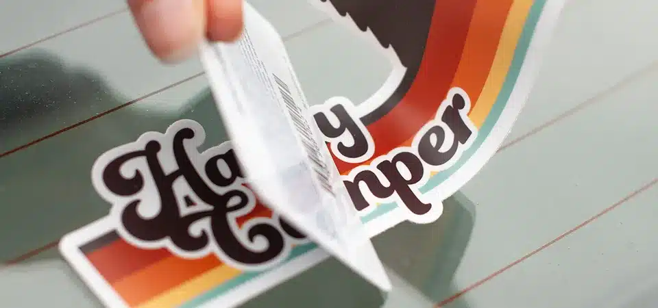 A magnified view of a dirty sticker back showing dust and oils