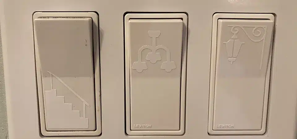 A single, beautiful floral sticker applied to a white light switch cover