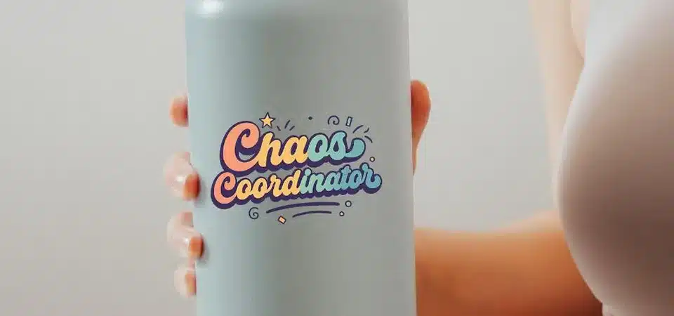 A close-up shot of a tiny brush applying clear nail polish to the edge of a sticker on a bottle