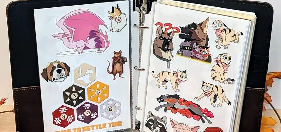 An open reusable sticker album filled with various stickers neatly arranged on its pages