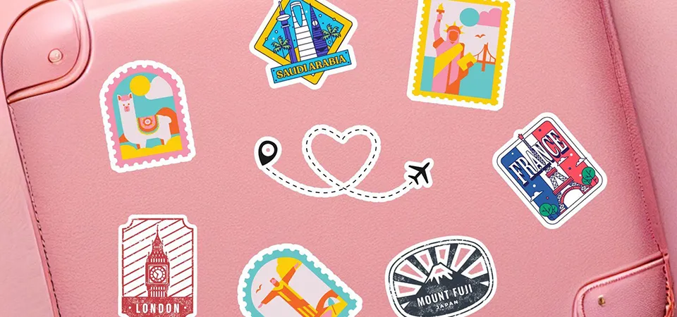 A hard-shell suitcase decorated with stickers from various countries and cities