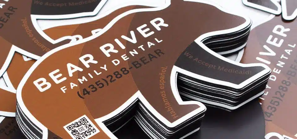 A die-cut sticker being cut out from a magnet sheet with a craft knife