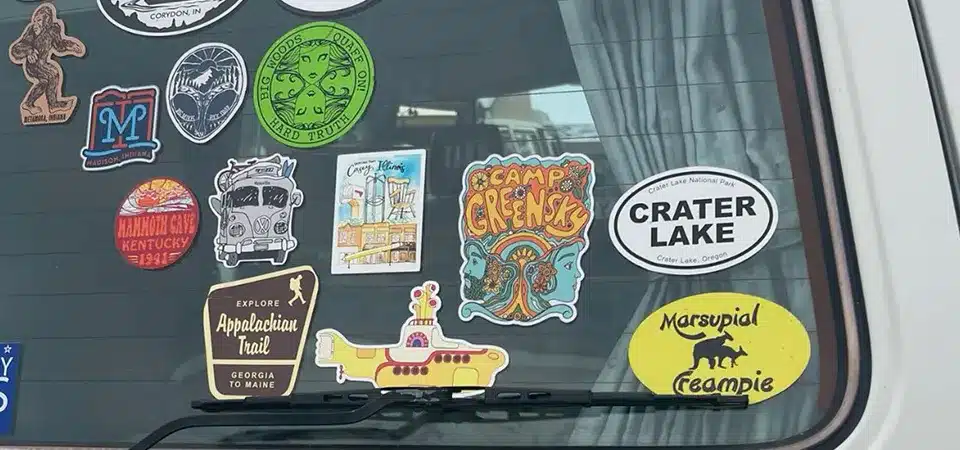 A graphic comparing the cost-per-impression of car stickers to other advertising forms