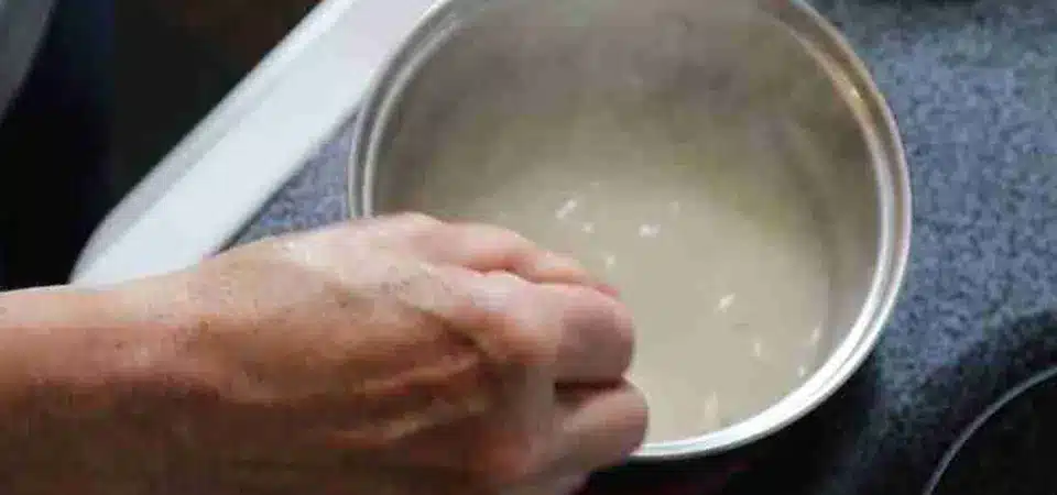 A small bowl with a homemade flour paste and a spoon