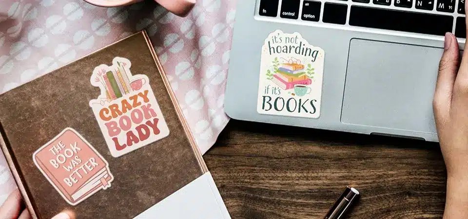 A vinyl sticker being placed on wax paper for storage