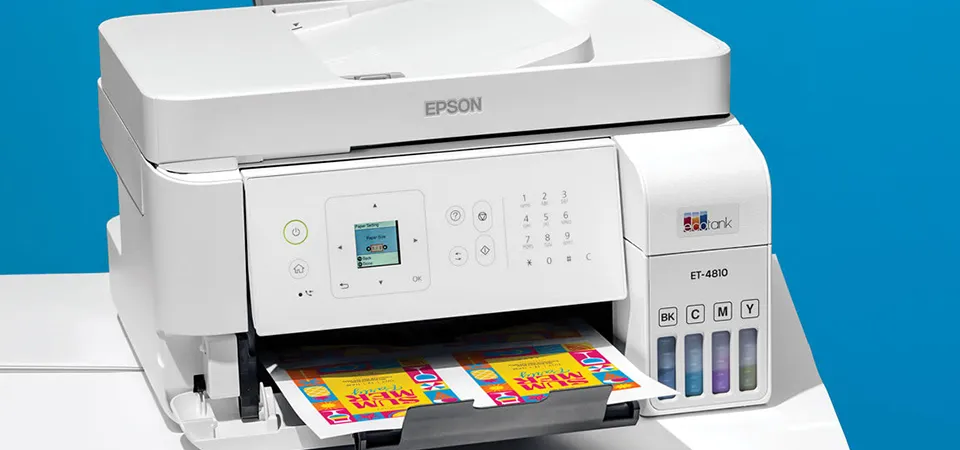 A frustrated person trying to pull jammed sticker paper out of a standard office printer