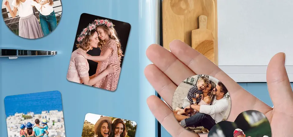 A hand testing a small magnet against the surface of a new fridge in a store