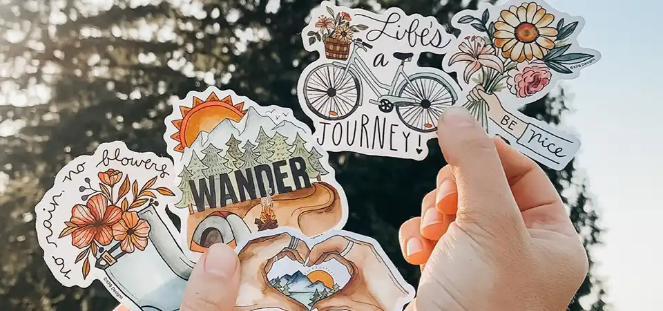 A Cricut machine cutting out perfectly shaped stickers from a laminated sheet
