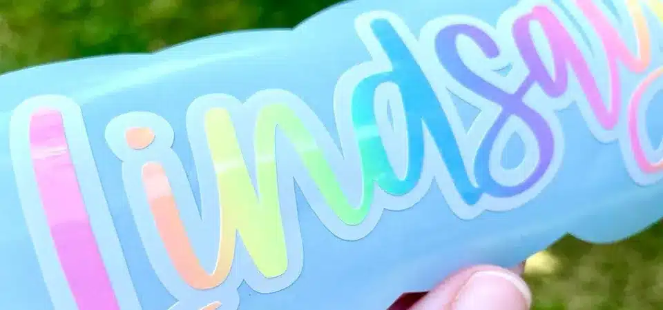 A close-up of different types of vinyl letter stickers in various colors and finishes