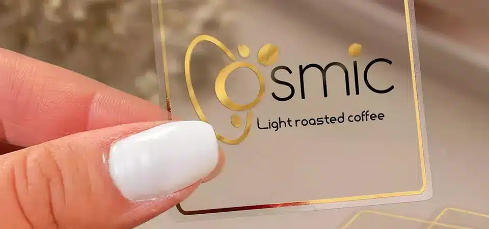 Examples of clear vinyl stickers on product packaging, a window, and a planner