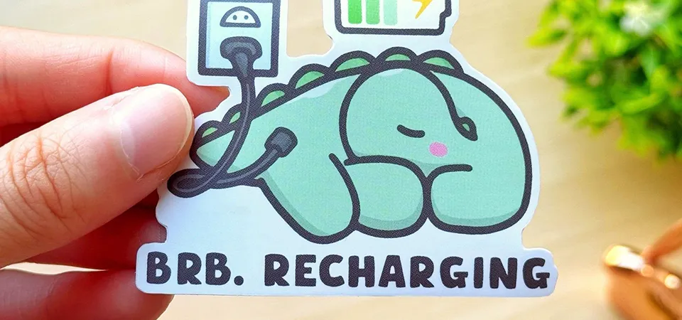 A collection of fun vinyl stickers on a laptop lid