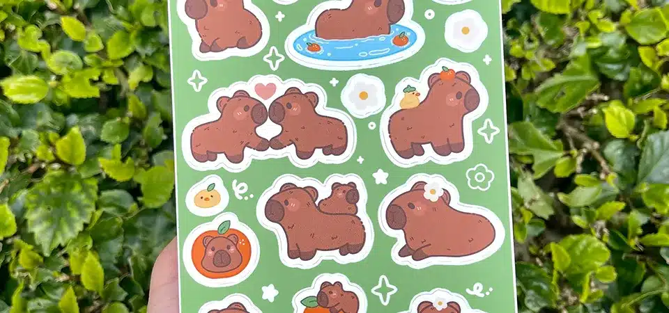 A sticker sheet featuring a variety of cute illustrated jungle animals like a lion, monkey, and elephant