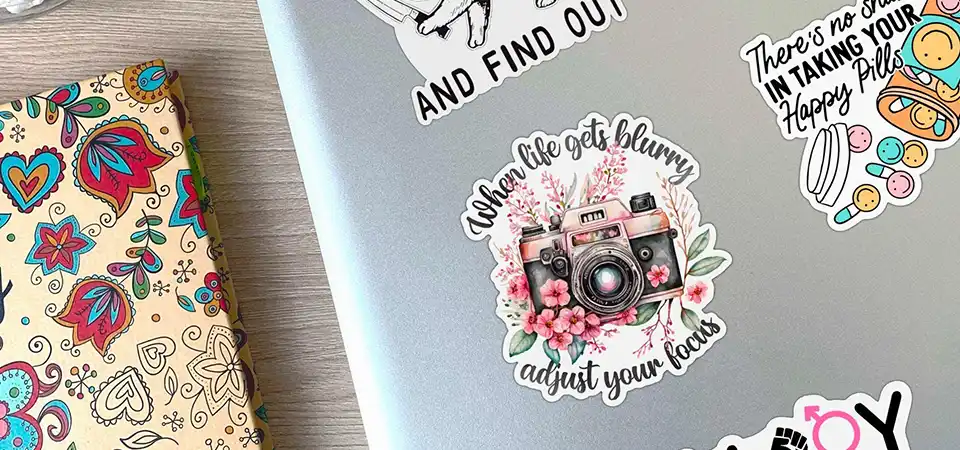 Kiss Cut Sticker Sheet A sticker sheet showing several kiss cut stickers, with one being peeled off to show the intact backing