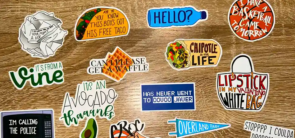 Handing out Die Cut Stickers A person handing out a cool, uniquely shaped die cut sticker at a trade show