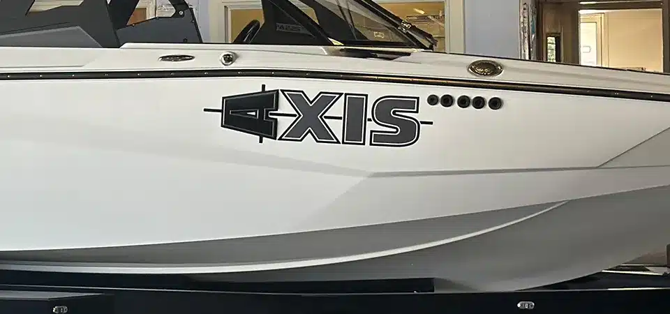 A before-and-after shot of a boat hull with old decals removed