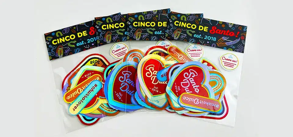 Professional Sticker Pack Packaging Ideas A photo gallery showing professionally packaged sticker packs with backing cards and in cellophane bags