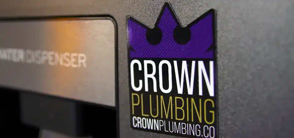 A comparison of a DIY hand-cut magnet next to a professionally die-cut magnet with clean edges