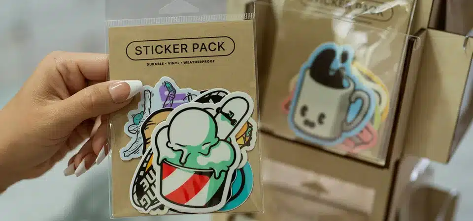 A professionally packaged sticker pack with a branded header card