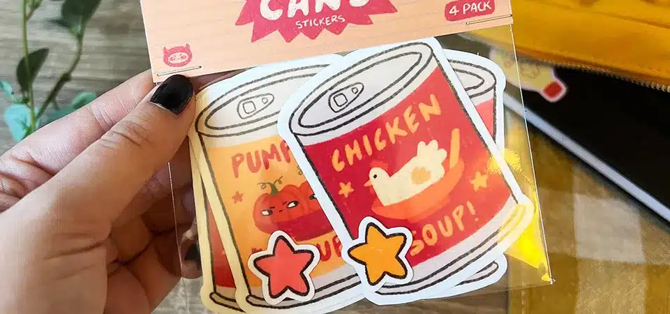 A clear comparison showing an individually cut multi-design pack versus a single sticker sheet