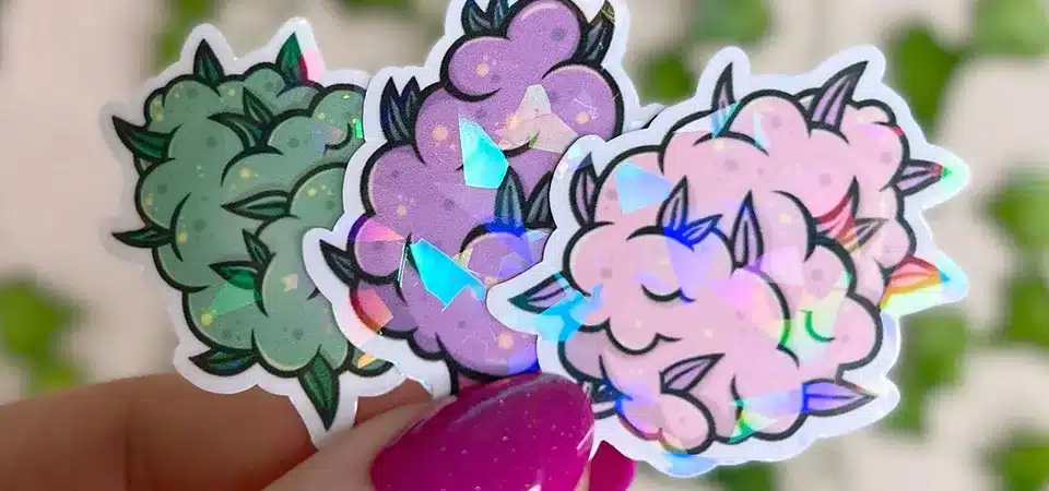 Gloss vs. Matte Holographic Sticker Finish A photo comparing a gloss finish holographic sticker to a matte finish one