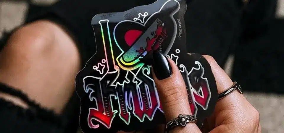 Comparing a Plain Sticker to a Holographic Sticker A comparison showing a plain sticker next to a vibrant holographic sticker on a product