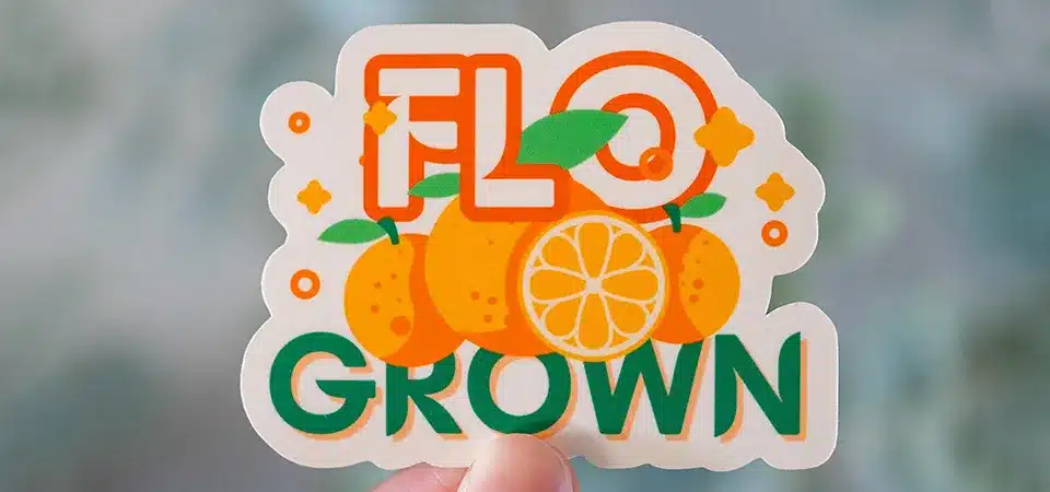 A graphic showing a scratch being deflected by the clear laminate layer over a sticker's ink