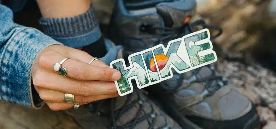 Person applying a sticker pressing from center outward