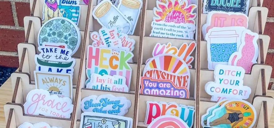 Open binder with clear sleeves holding sticker sheets