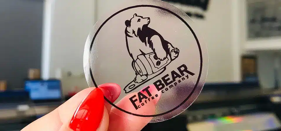 Drying printed clear stickers A printed sheet of clear inkjet stickers laid out on a flat table to dry