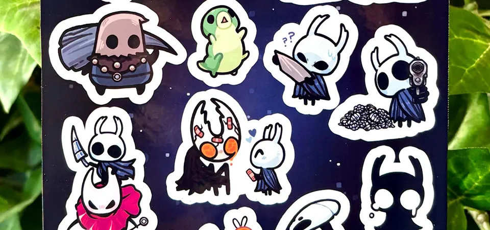 A close-up of a Cricut machine cutting a sticker sheet, following the registration marks