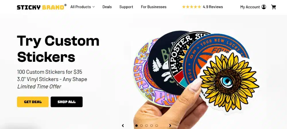 A close-up of a vibrant, durable sticker on a snowboard, showing its resilience in the snow