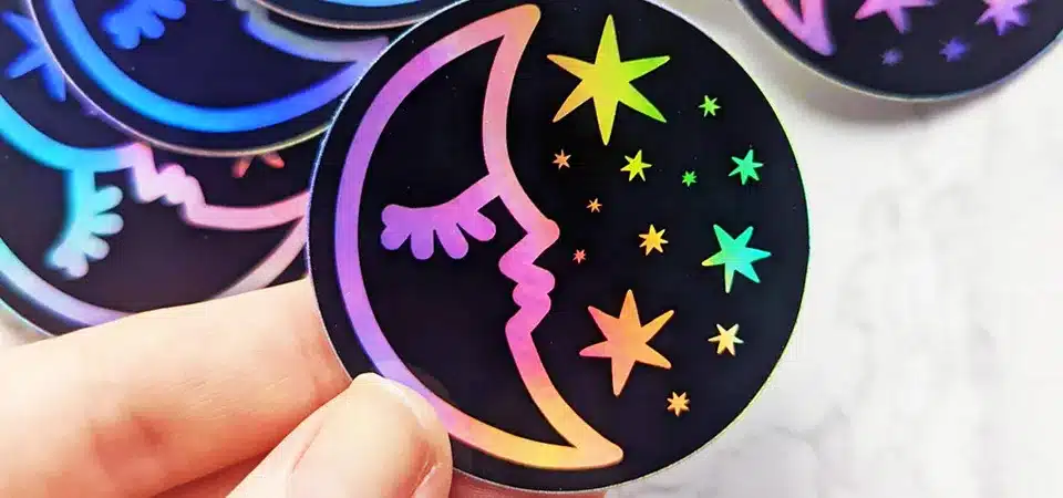 A craft beer holographic sticker showing a mountain landscape against a cosmic sky