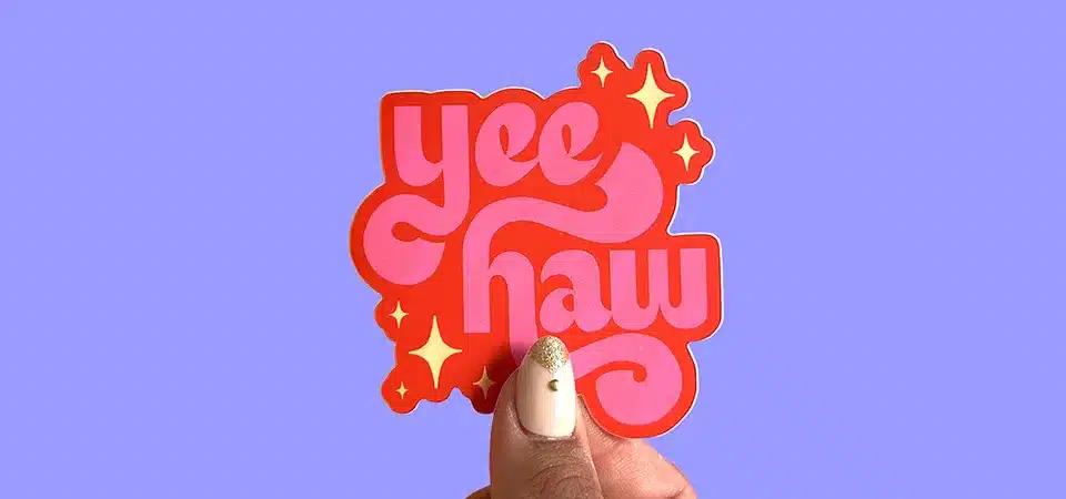 Spraying soapy water on a window before applying a large vinyl decal