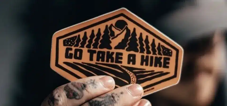 A stack of vinyl sticker sheets showing their plastic-like quality