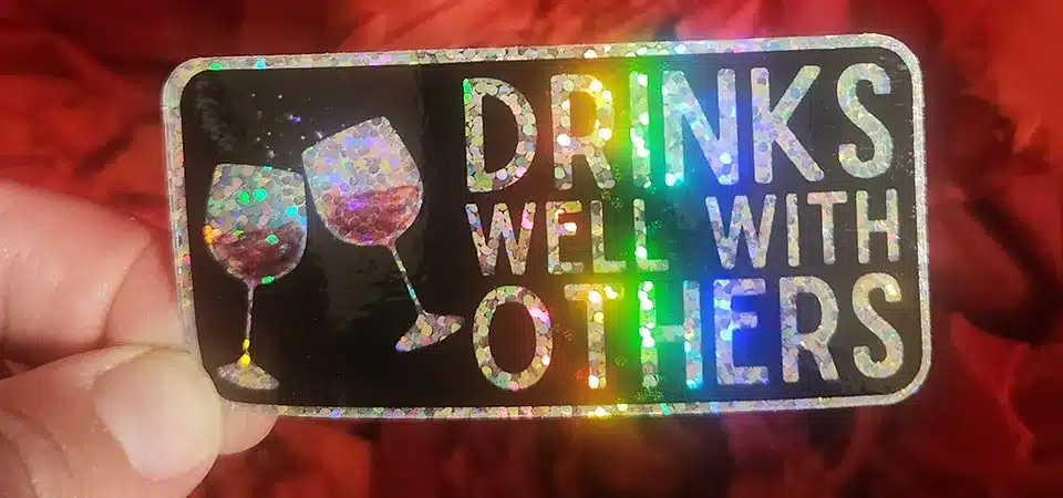 A holographic anniversary sticker for Wooden Hill Brewing Company