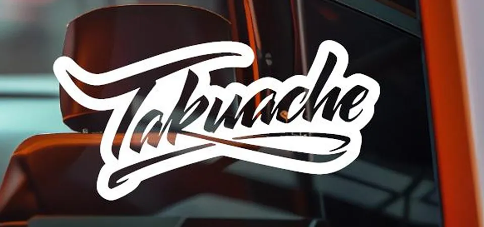 Hands applying a sticker to a car window with a squeegee