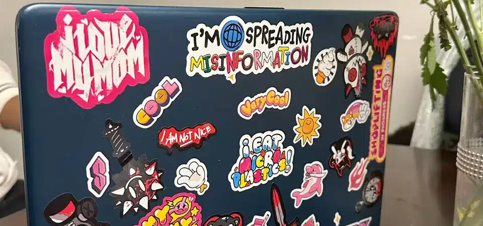 Diagram of a laptop showing the A-shell lid and palm rest areas