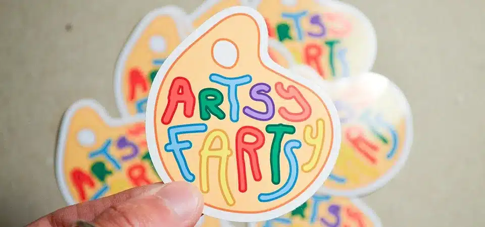 Water bottle with durable vinyl stickers attached