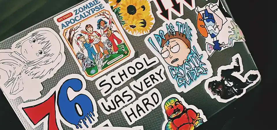 Image of laptop vents and hinges with a warning symbol