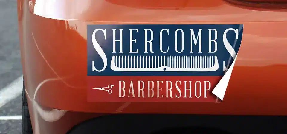 A car bumper with a cool, well-designed bumper sticker for a local small business