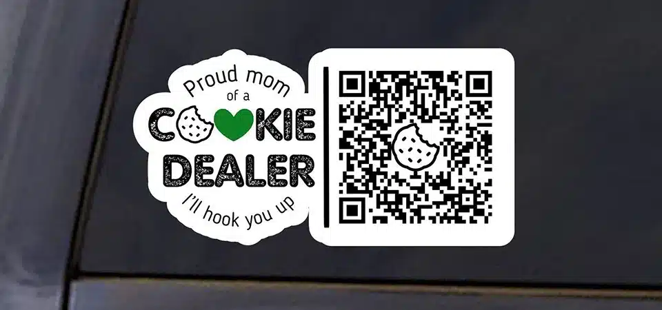 A small QR code sticker on a product tag that says "Scan to See Our Story"