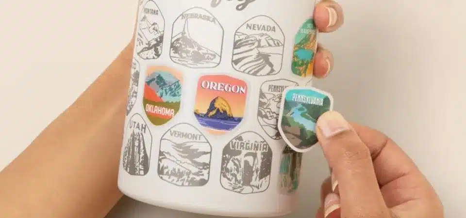 A close-up of a roll of custom printed stickers showing low-cost mass production